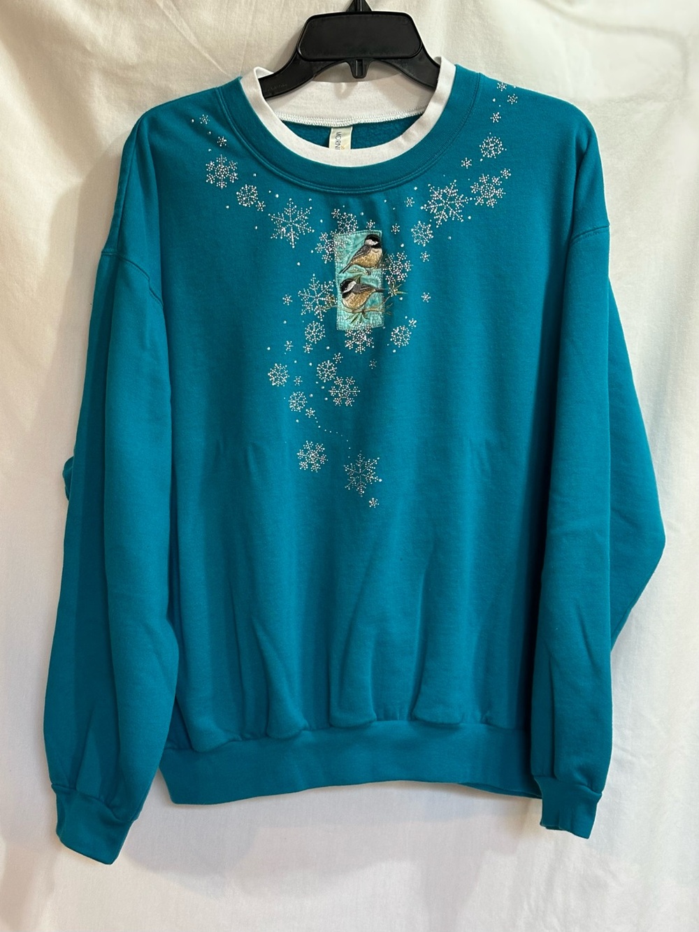 Morning Sun Teal Sweatshirt with a Bird & Snowflake surrounded by rhinestones.